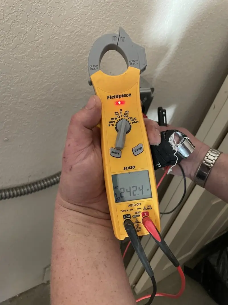 Voltage testing with clamp meter during Electrical Installation Services in Princeton